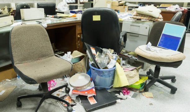 Dirty, messy and abandoned office, poor light